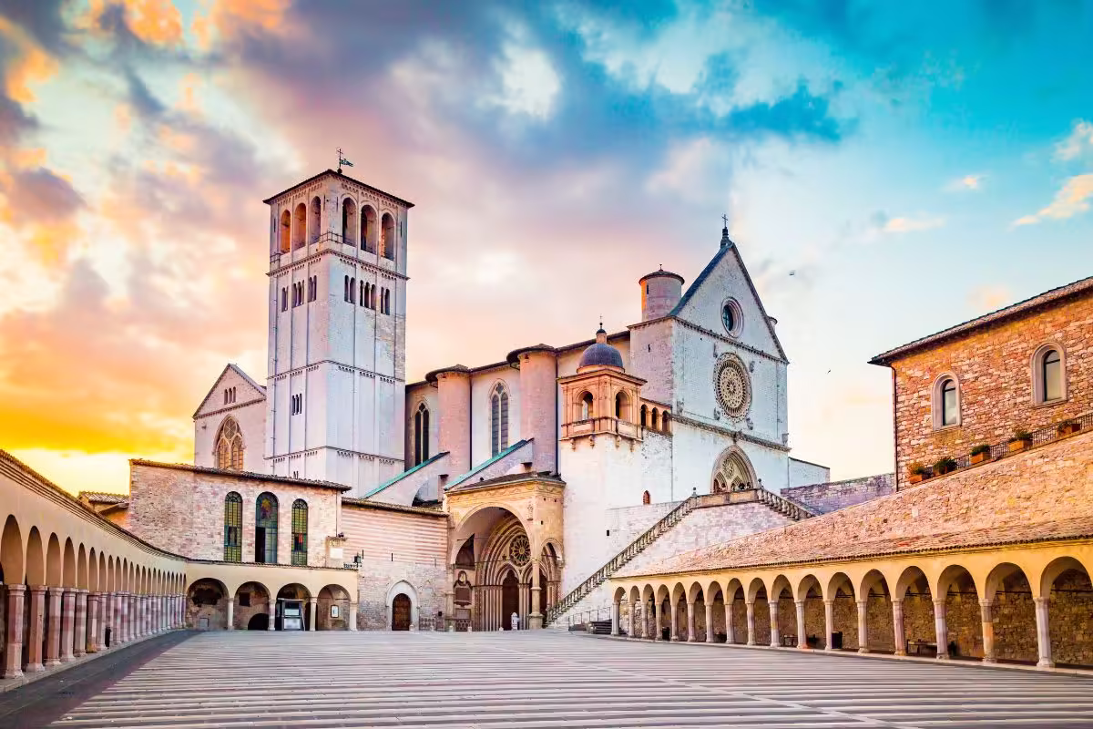 Basilica of St. Francis of Assisi at sunset, Assisi, Umbria, Italy⁠